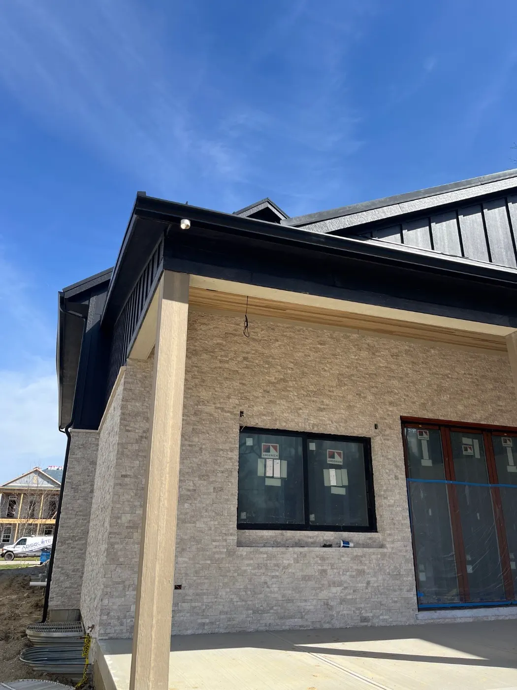 Siding installation documented in Station Hill